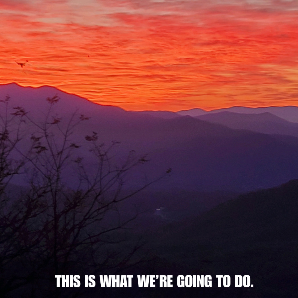 Sunset over the mountains of Western NC. Text overlay on the image that says "This is what we're going to do". 